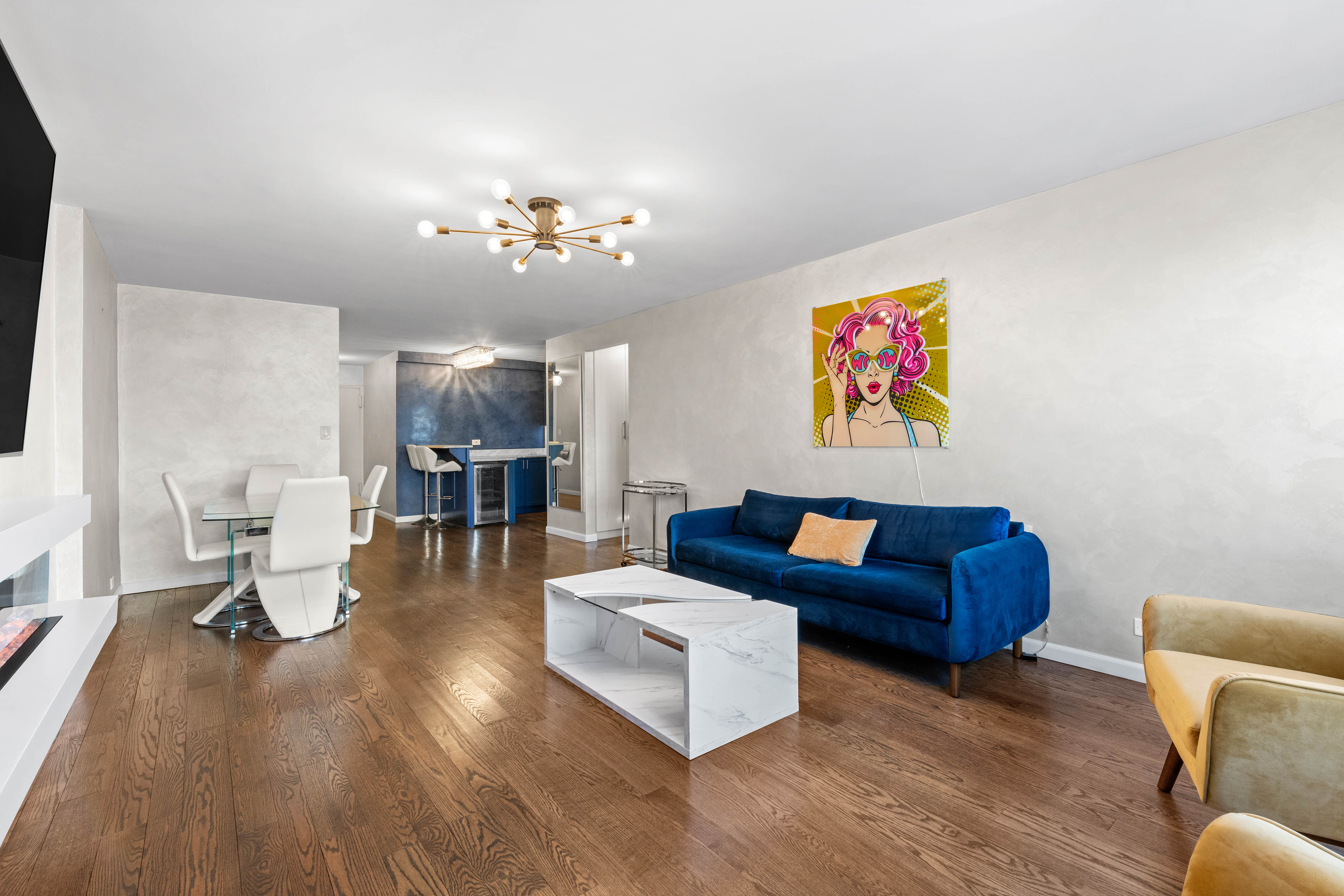 102-10 66th Road, Unit K25 Queens, NY 11375 - Photo 1 of 19 a living room with furniture and wooden floor