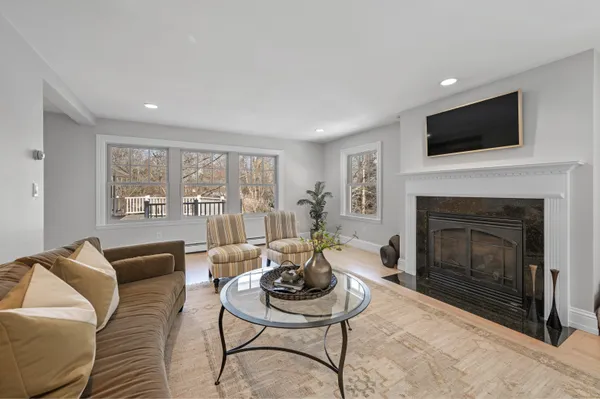 a bedroom with a bed and a couch with window