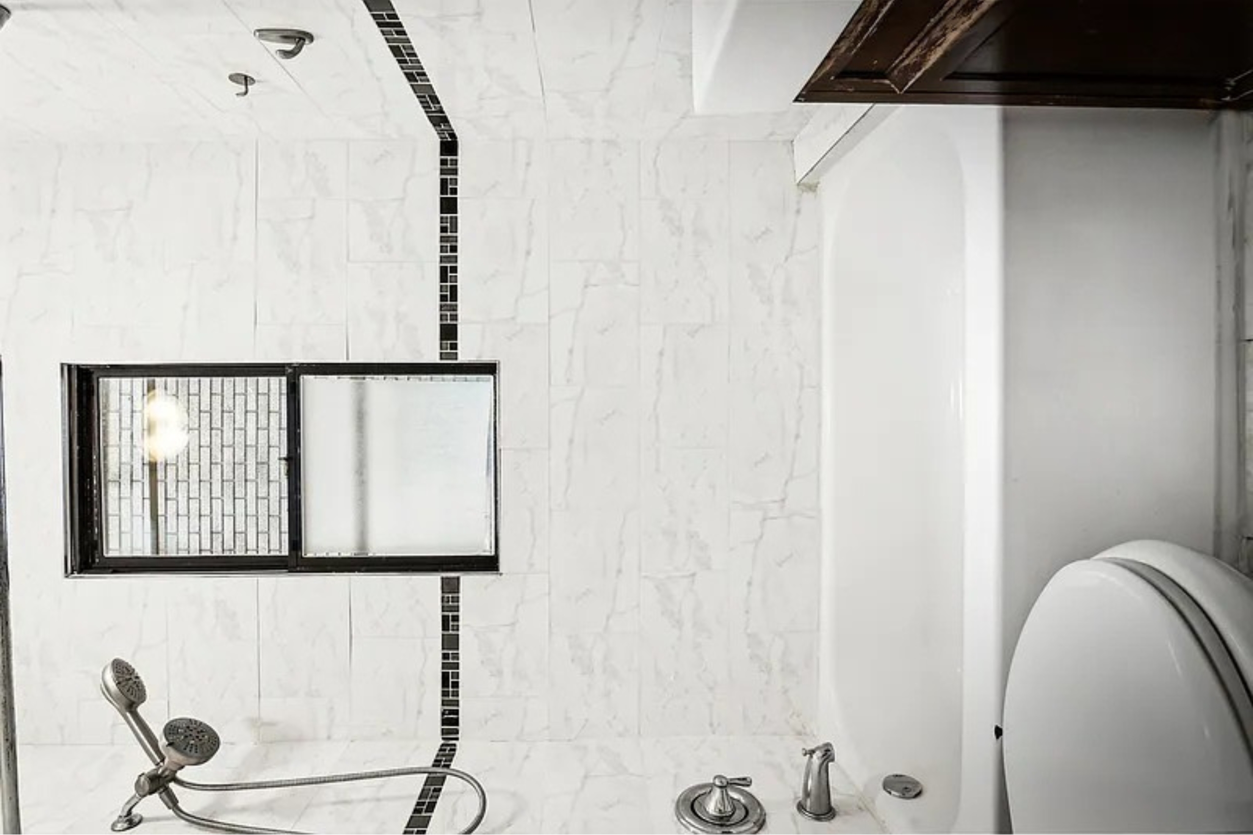 22-42 41st Street, Unit 2R Queens, NY 11105 - Photo 10 of 10 a bathroom with a bathtub and a shower