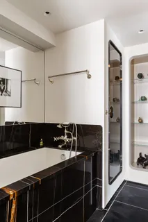 a bathroom with a sink a mirror and shower