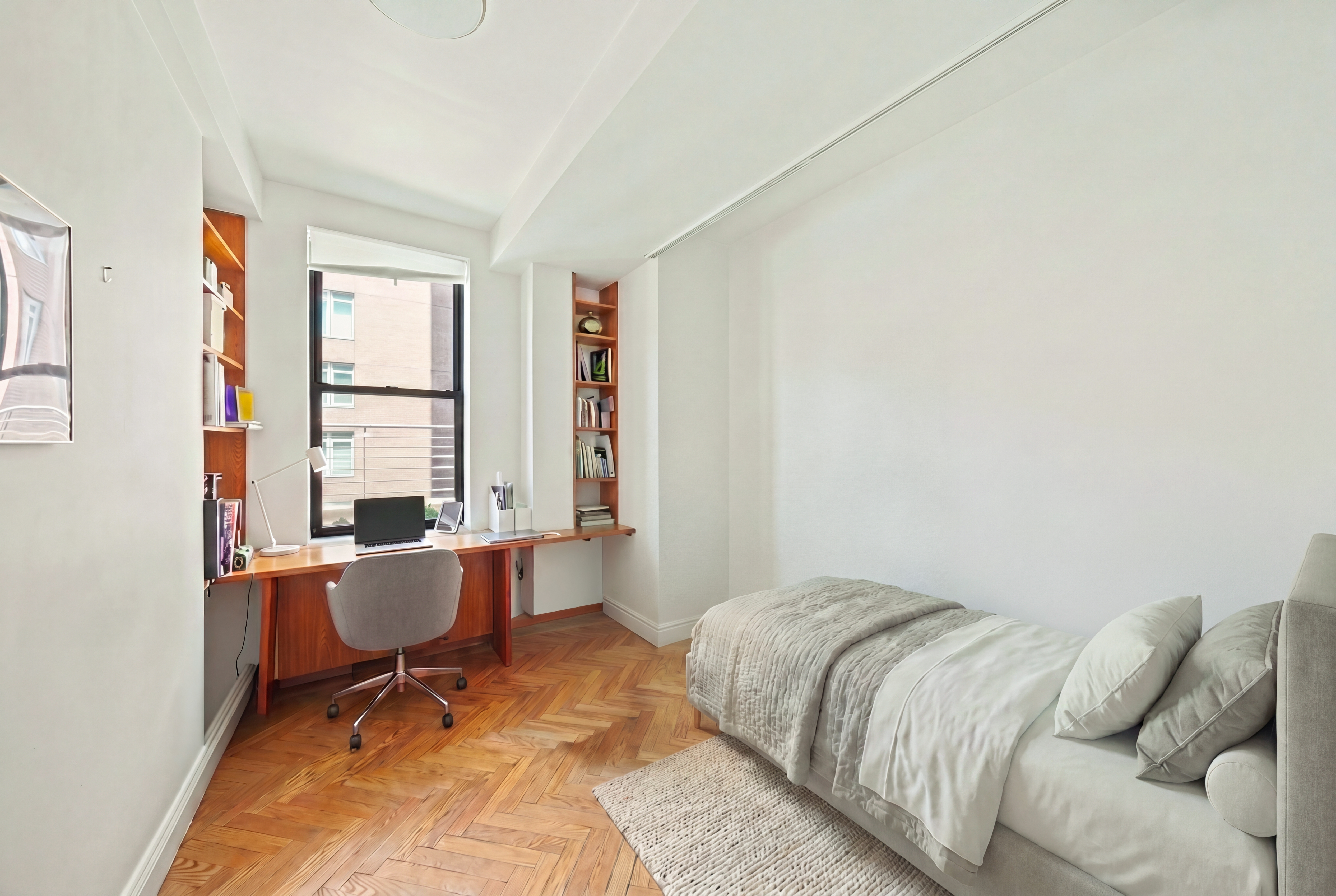 177 East 77th Street, Unit PHC Manhattan, NY 10075 - Photo 15 of 26 a bedroom with a bed and a window
