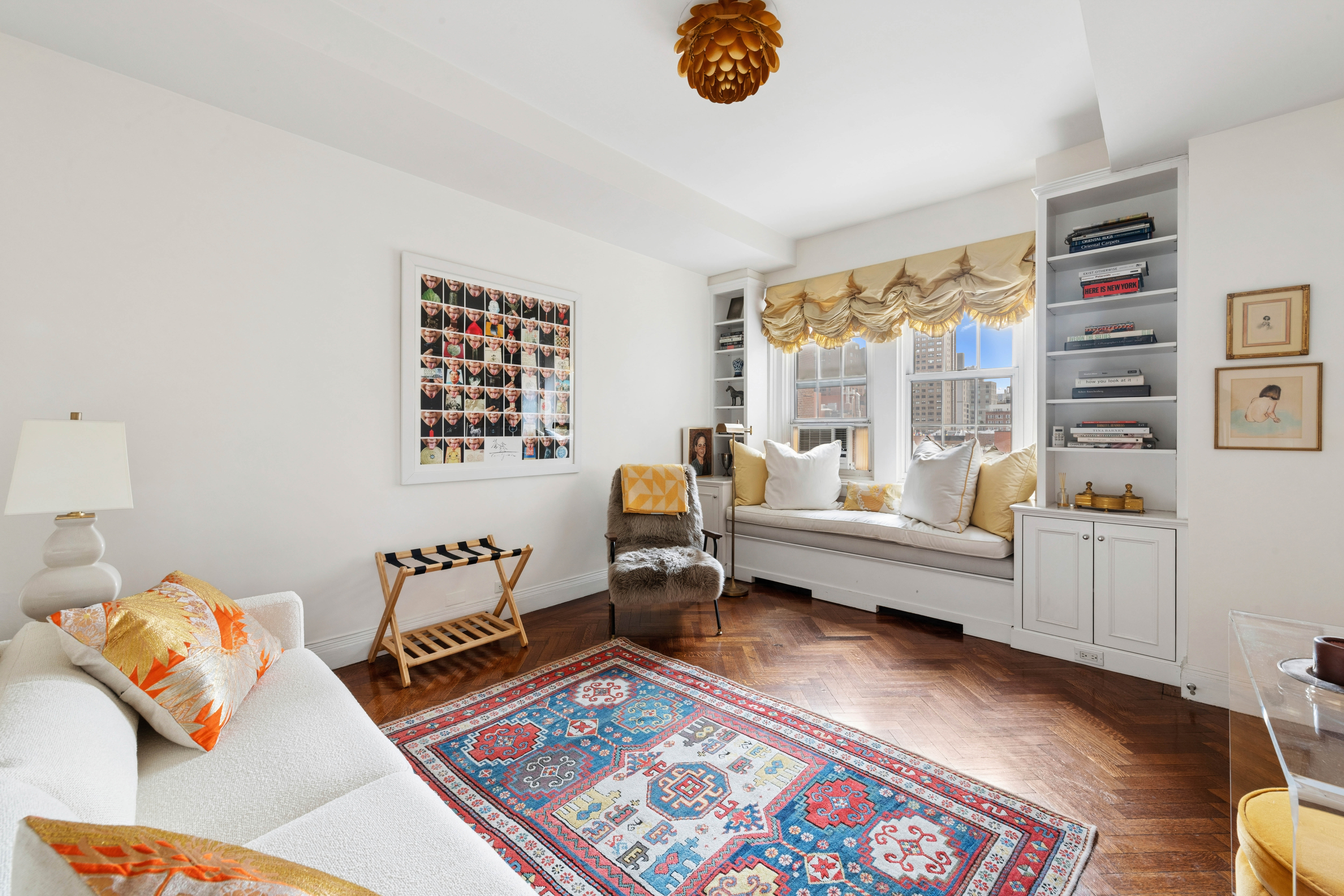 520 East 86th Street, Unit 9B Manhattan, NY 10028 - Photo 12 of 18 a living room with furniture and a rug