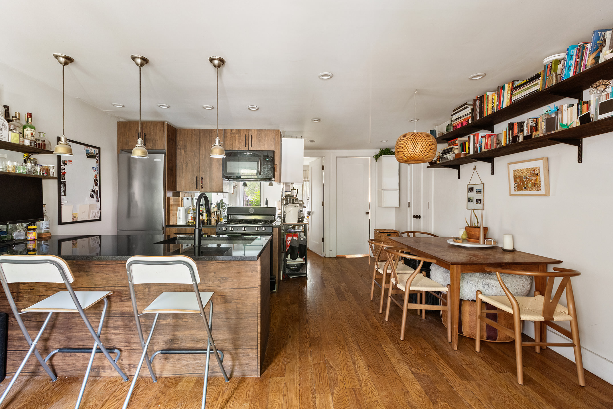 237 Macon Street, Unit 1 Brooklyn, NY 11216 - Photo 1 of 9 a view of a dining room with furniture and wooden floor
