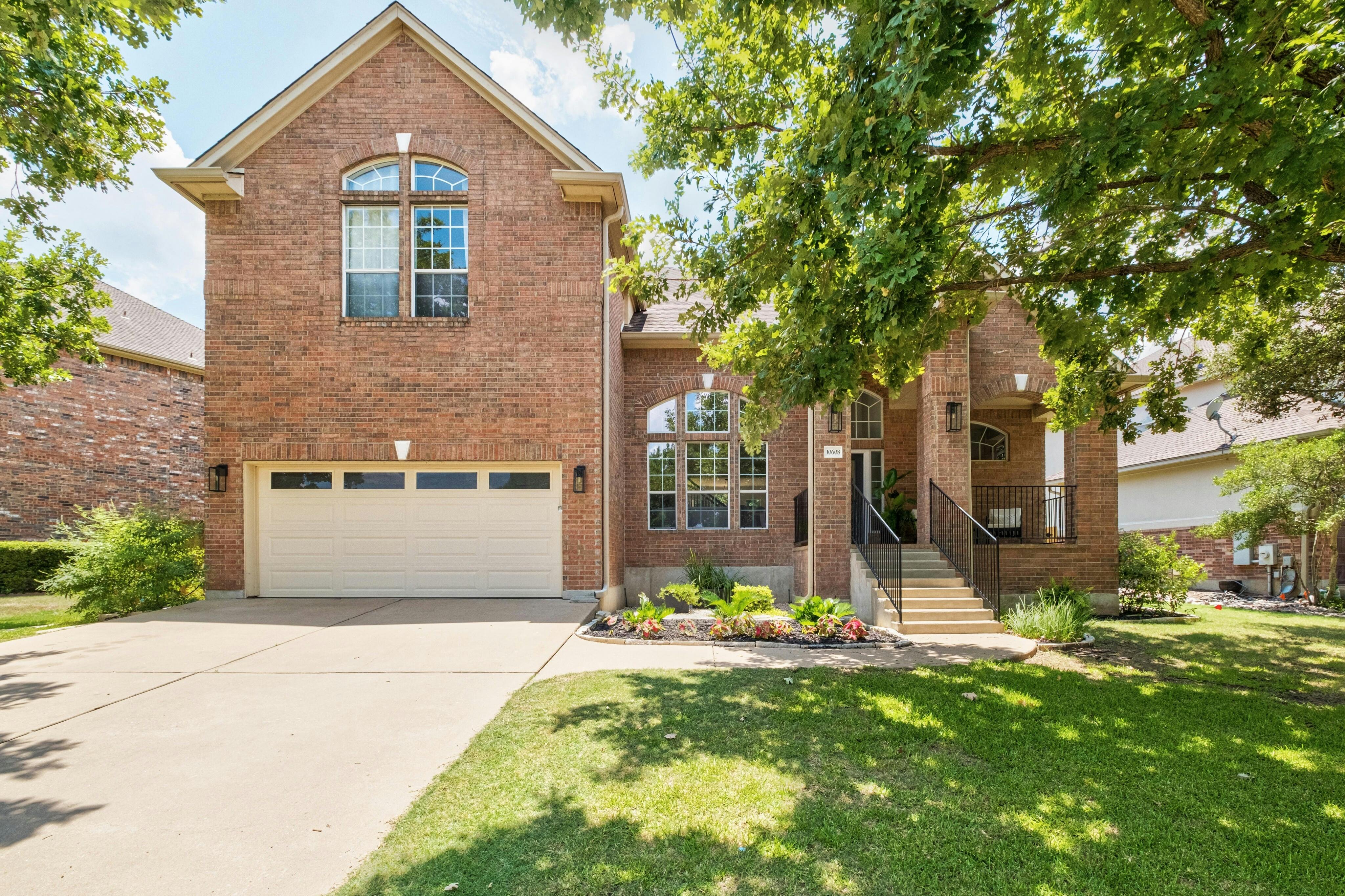 10608 Pointe View Drive Austin, TX 78738 - Photo 2 of 46 a front view of house with yard