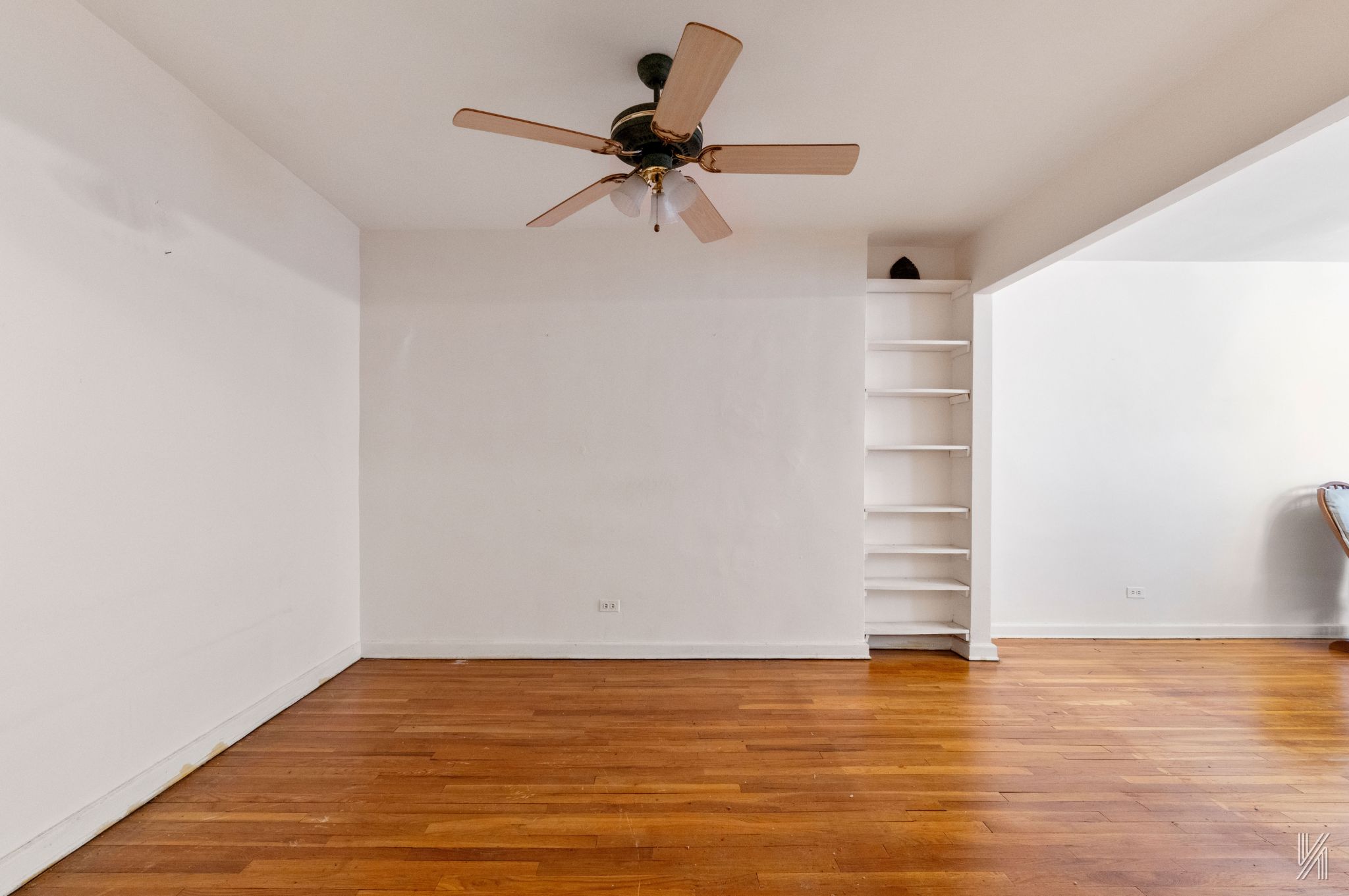 33-45 92nd Street, Unit 5G Queens, NY 11372 - Photo 3 of 8 a view of a room with wooden floor and white walls