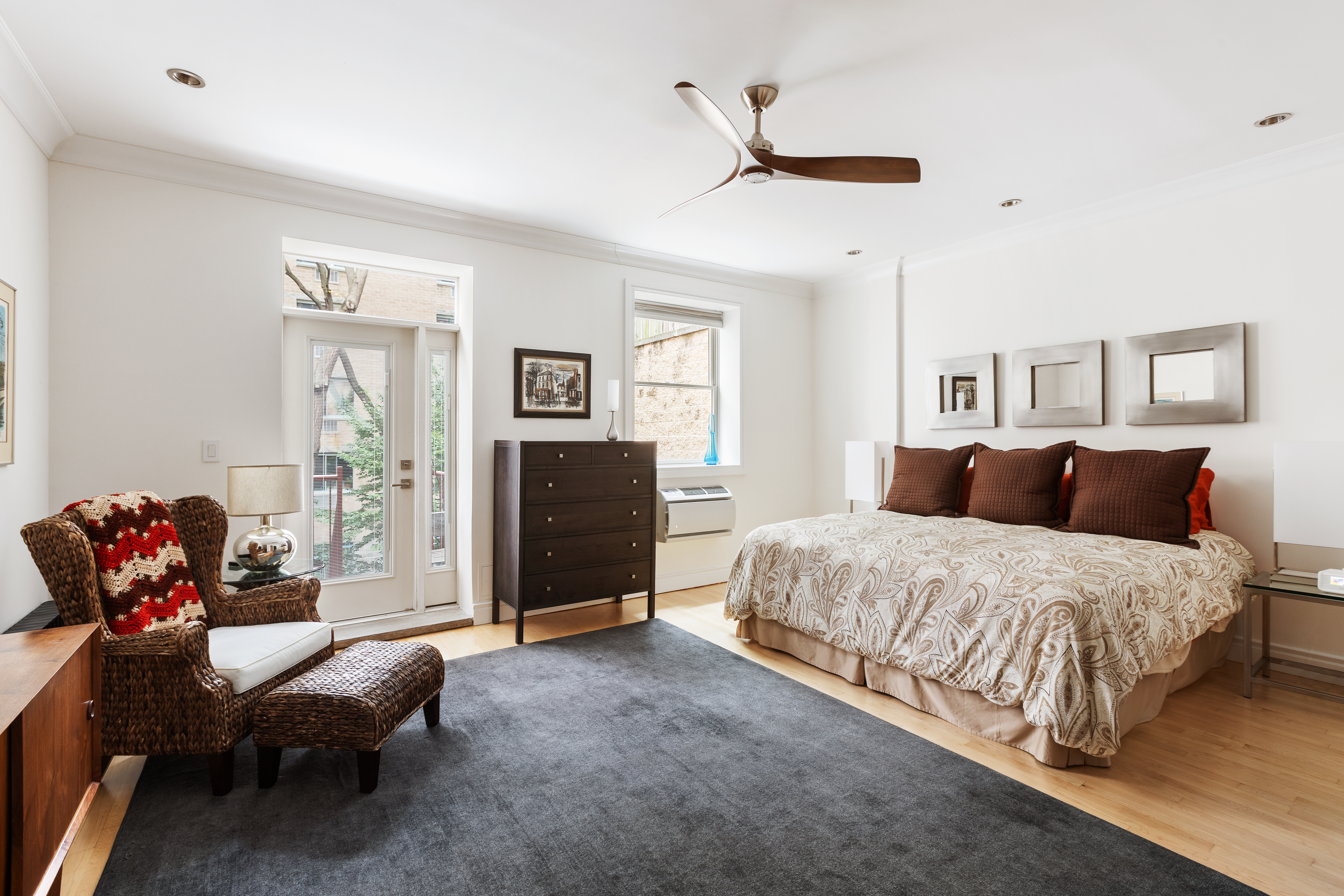 203 East 7th Street, Unit 2 Manhattan, NY 10009 - Photo 6 of 9 a spacious bedroom with a bed and a couch