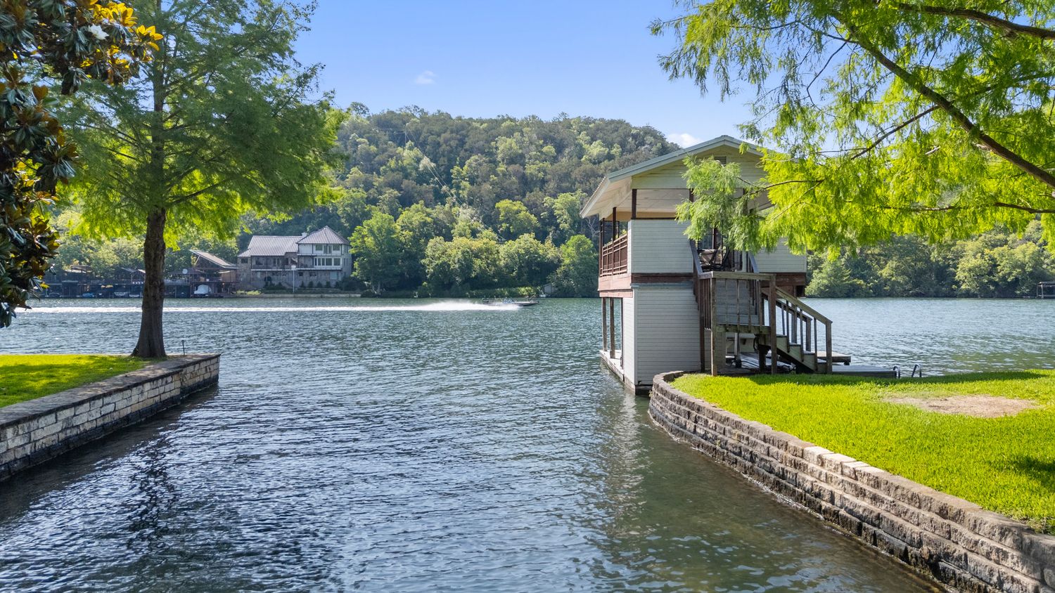 a view of a swimming pool with a patio and a yard