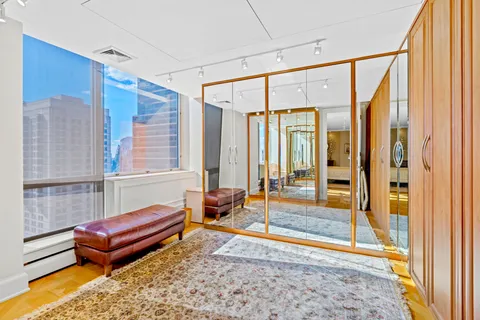 a backyard of a house with couches table and chairs