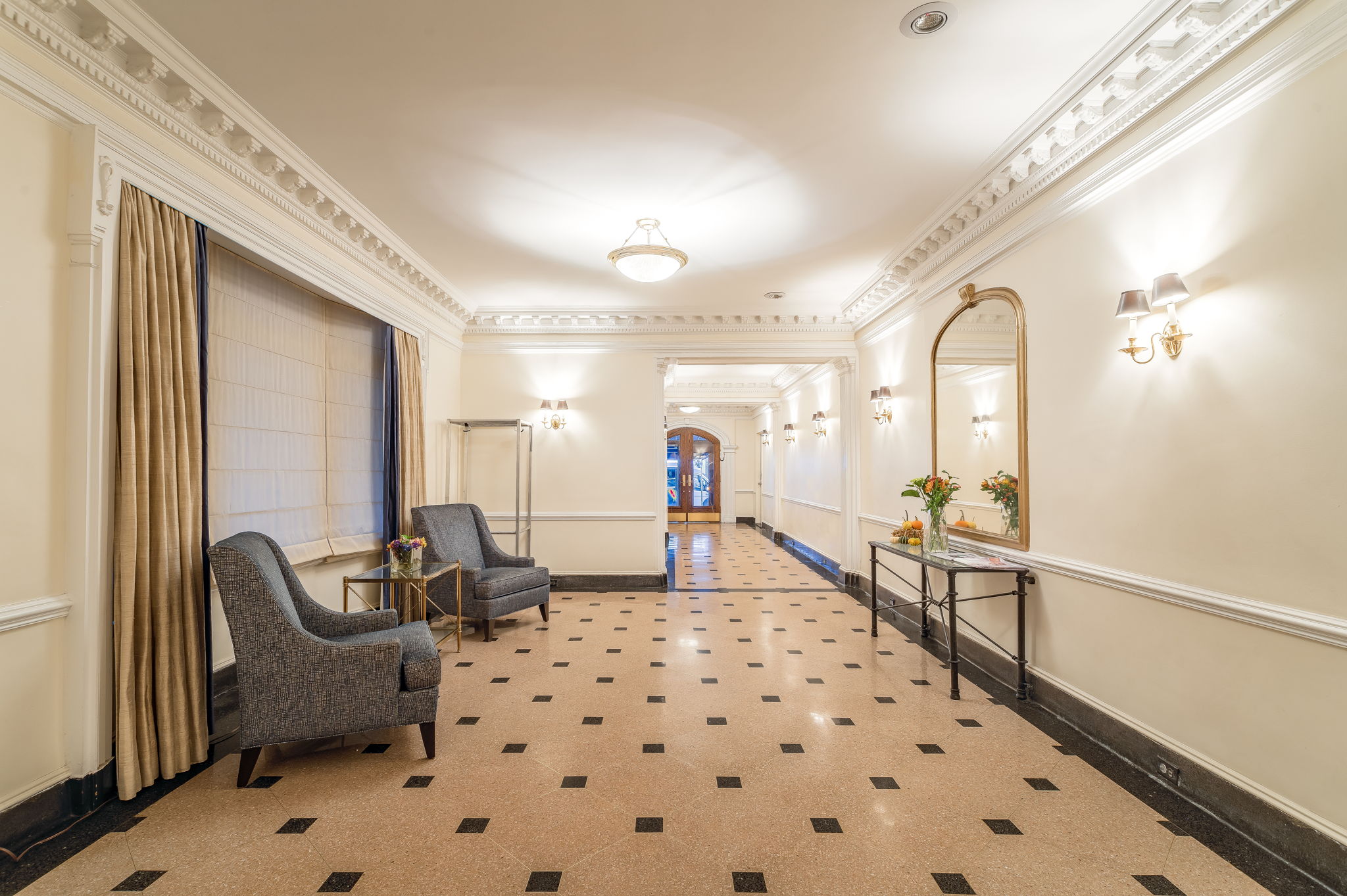 61 East 86th Street, Unit 25 Manhattan, NY 10028 - Photo 8 of 9 a bedroom with furniture and a window