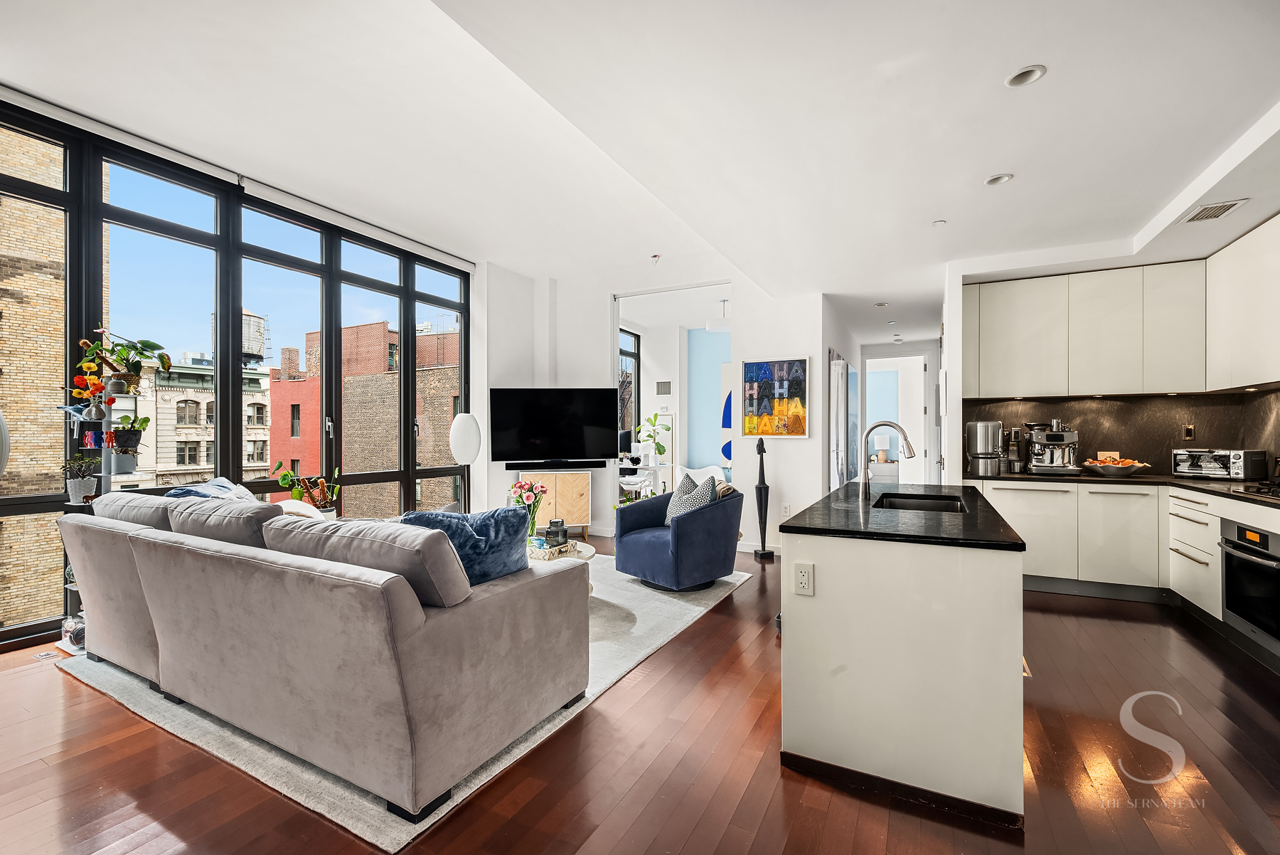 4 West 21st Street, Unit 14A Manhattan, NY 10010 - Photo 1 of 16 a living room with furniture and a flat screen tv