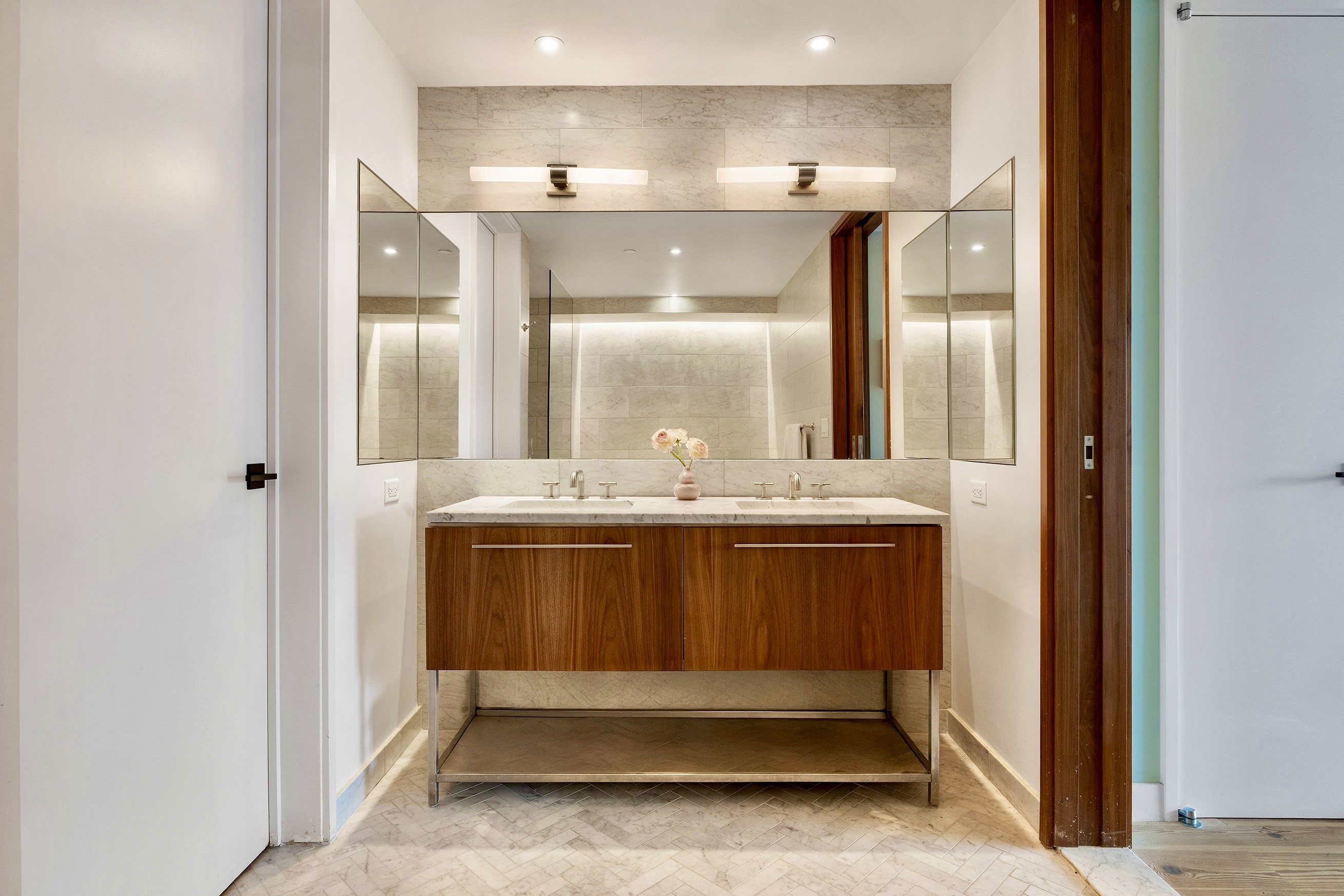 90 Furman Street, Unit N510 Brooklyn, NY 11201 - Photo 18 of 31 a bathroom with a sink and a mirror