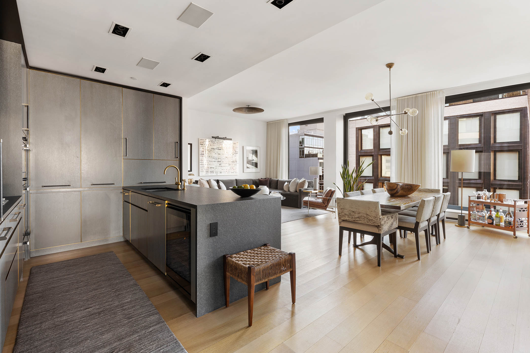 505 West 19th Street, Unit 8C Manhattan, NY 10011 - Photo 3 of 13 a living room with furniture window and wooden floor
