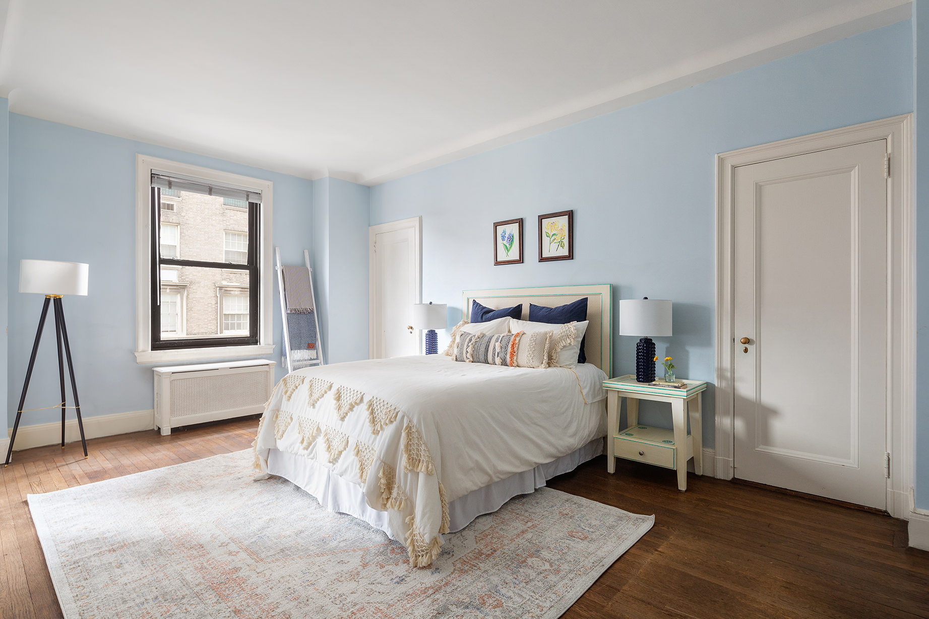 1115 5th Avenue, Unit 5B Manhattan, NY 10128 - Photo 14 of 19 a bedroom with a bed and a window