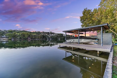 a view of a swimming pool with a lake view