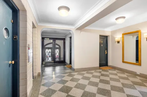 a view of a hallway with a bedroom