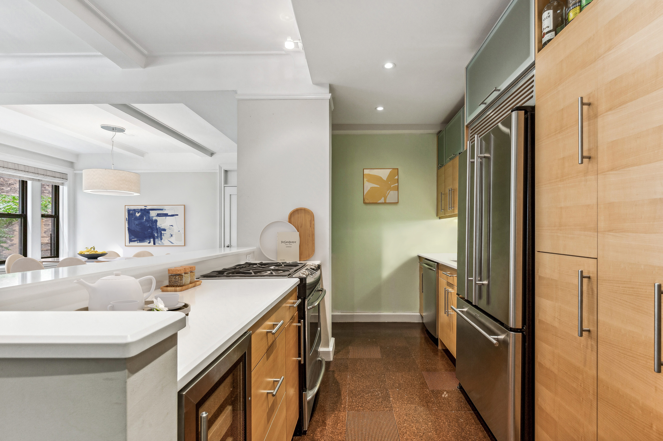 150 West 87th Street, Unit 7B Manhattan, NY 10024 - Photo 3 of 10 a kitchen that has a sink a stove and a refrigerator