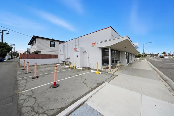 a view of a street with a building in the background