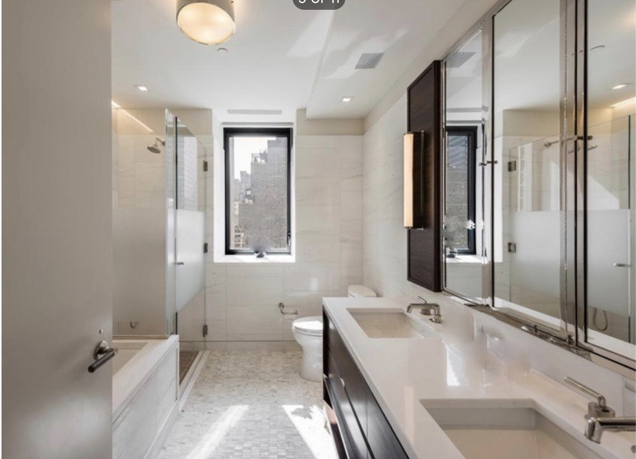 301 East 50th Street, Unit 17B Manhattan, NY 10022 - Photo 6 of 12 a bathroom with a tub sink and mirror