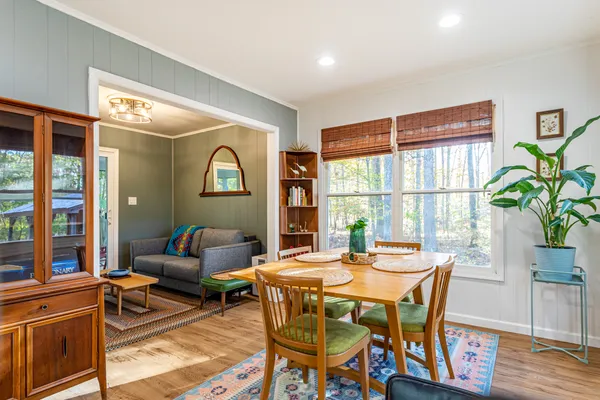a dining room with furniture and window