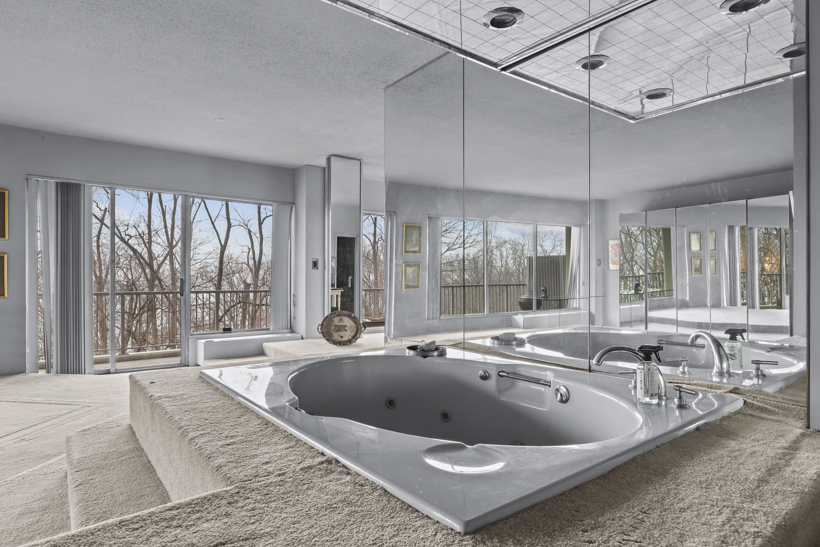 4455 Douglas Avenue, Unit 3FE Bronx, NY 10471 - Photo 35 of 53 a large white bed sitting in a room next to a window