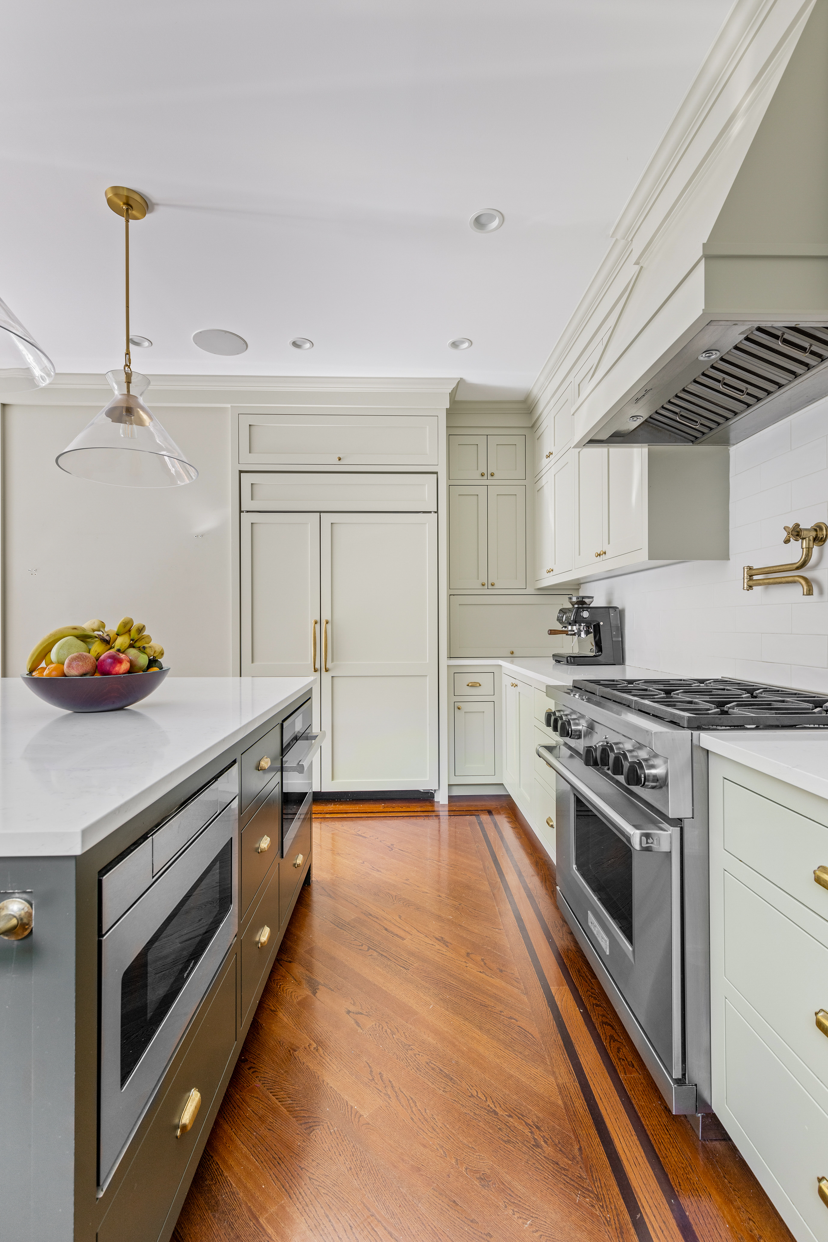 689 East 17th Street Brooklyn, NY 11230 - Photo 11 of 28 a kitchen with stainless steel appliances a stove and white cabinets