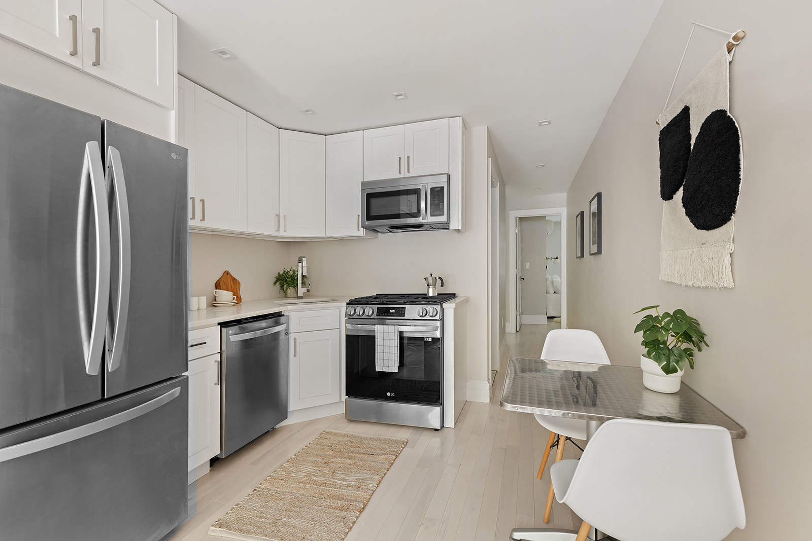 281 Jefferson Avenue Brooklyn, NY 11216 - Photo 19 of 25 a kitchen with stainless steel appliances granite countertop a refrigerator sink and stove
