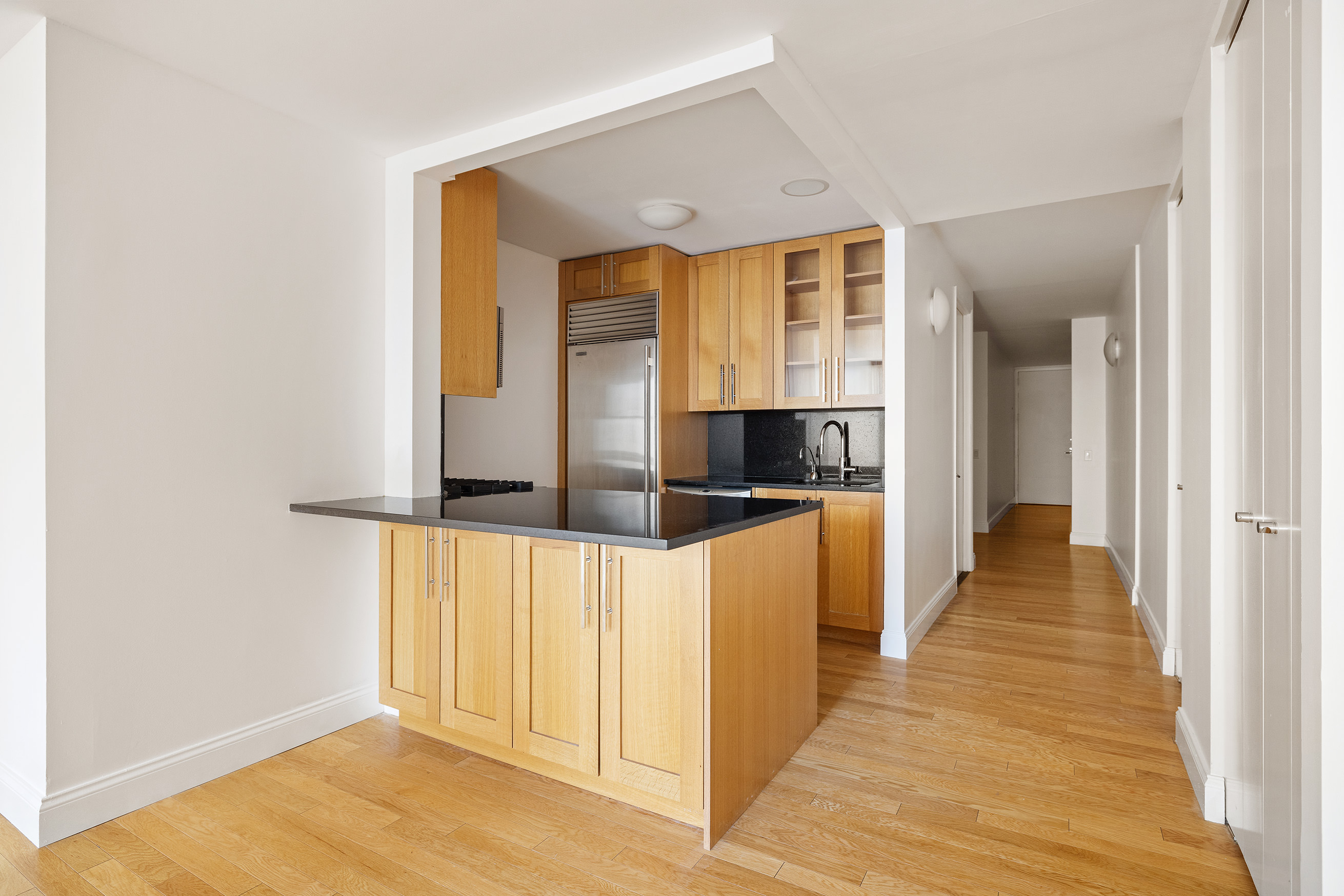 88 Greenwich Street, Unit 1014 Manhattan, NY 10006 - Photo 3 of 14 a view of a hallway with wooden floor and staircase
