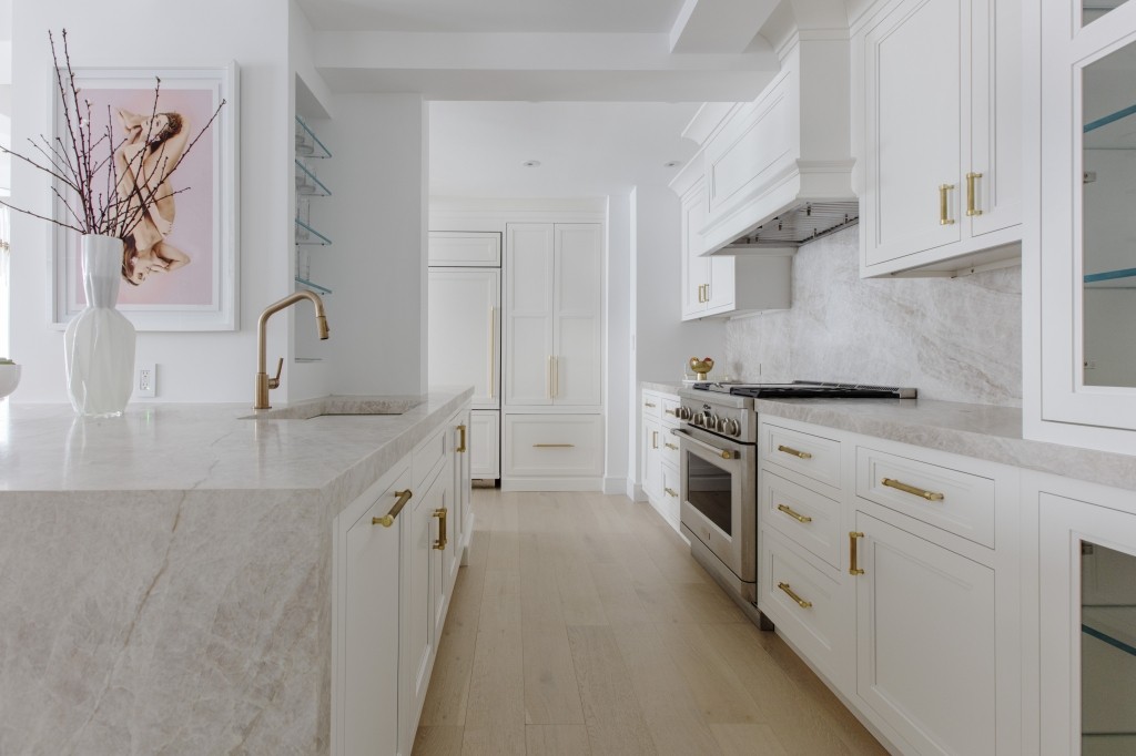 a kitchen with stainless steel appliances granite countertop a sink and a stove top oven