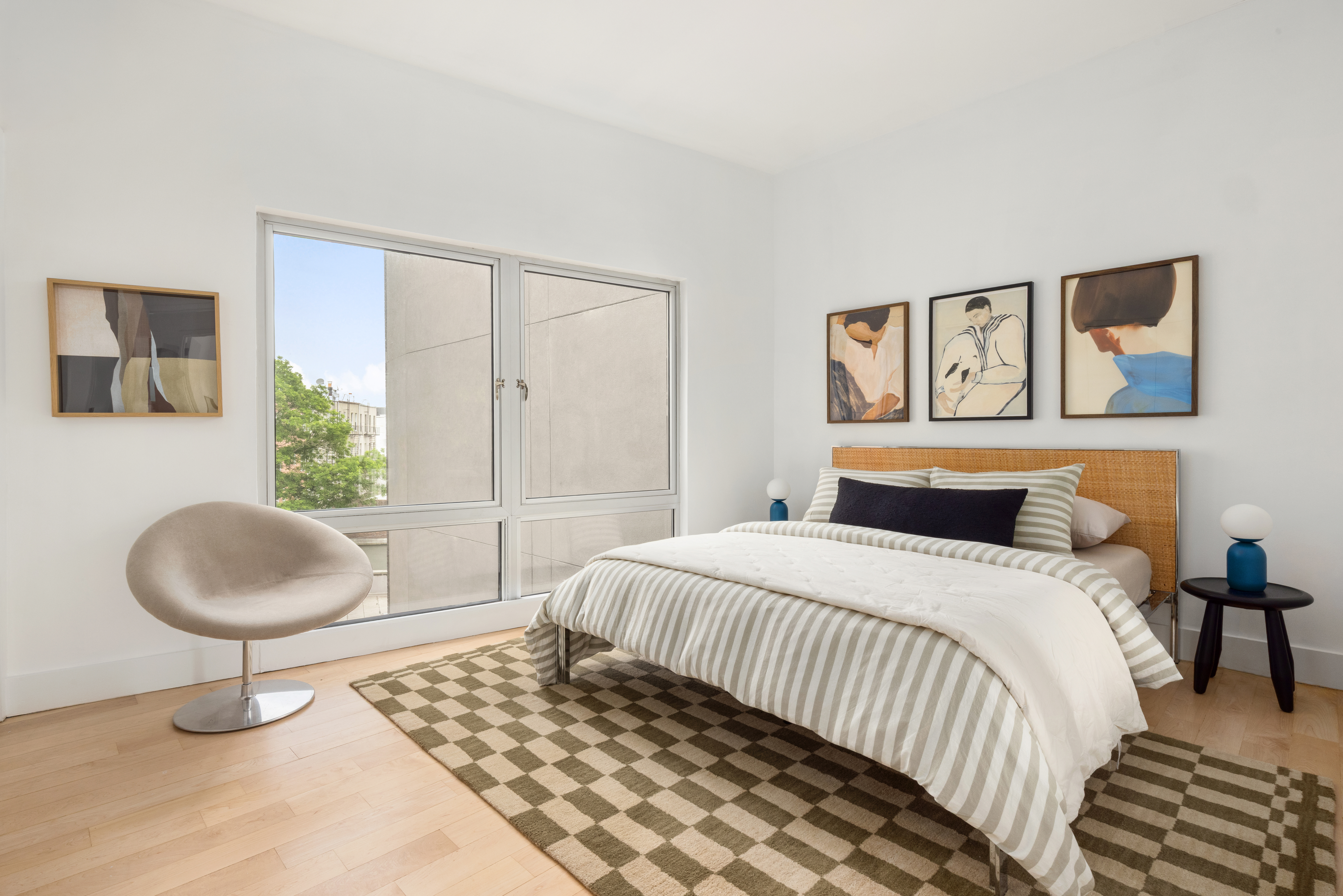 297 Driggs Avenue, Unit 4A Brooklyn, NY 11222 - Photo 7 of 9 a bedroom with a bed and a painting on the wall