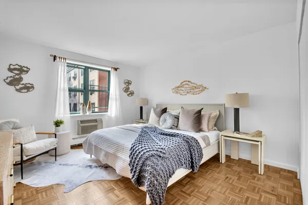 a bedroom with a bed and a couch