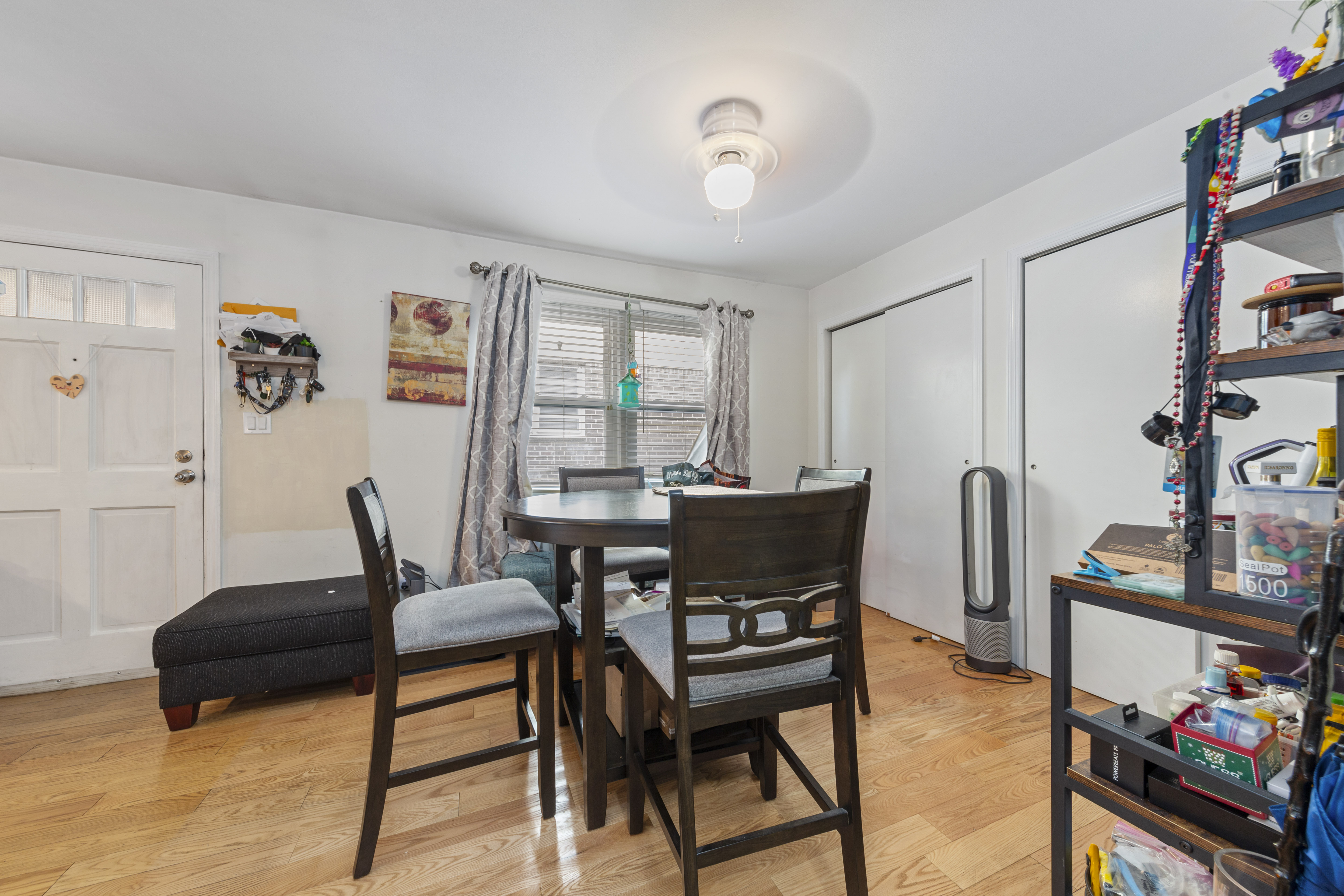 240-47 68th Avenue Queens, NY 11362 - Photo 7 of 39 a view of a dining room with furniture and a window