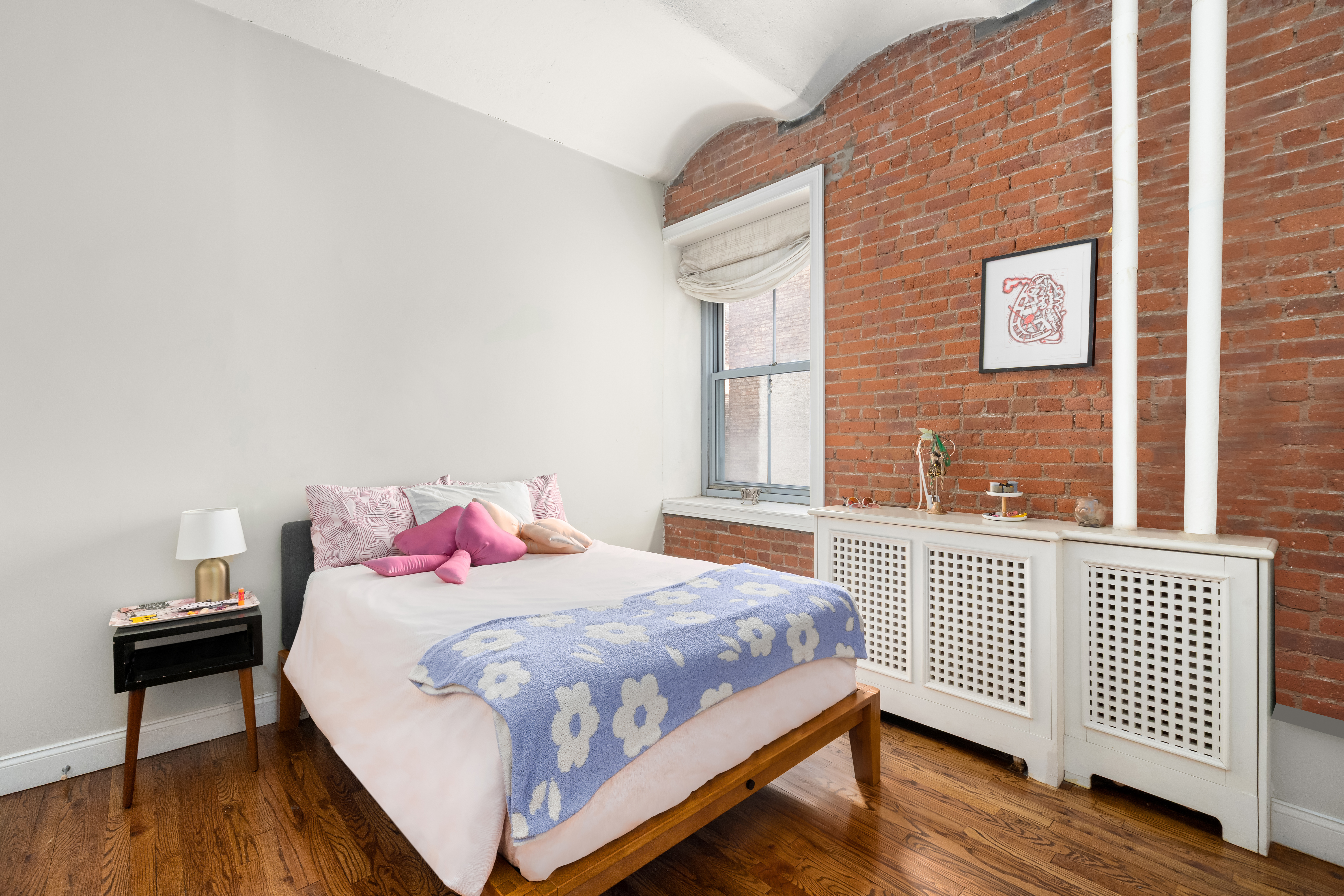 20-26 North Moore Street, Unit 4W Manhattan, NY 10013 - Photo 15 of 24 a bedroom with a bed and a window