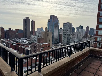 a view of city with tall buildings