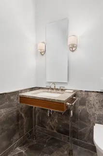 a room with a table and a mirror