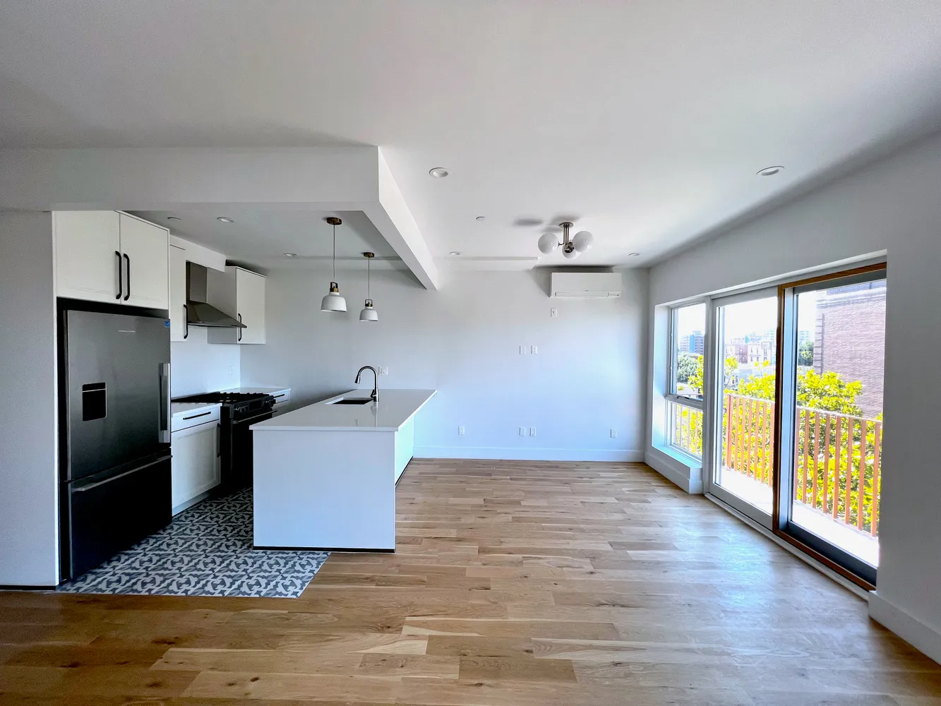 a living room with furniture and a floor to ceiling window