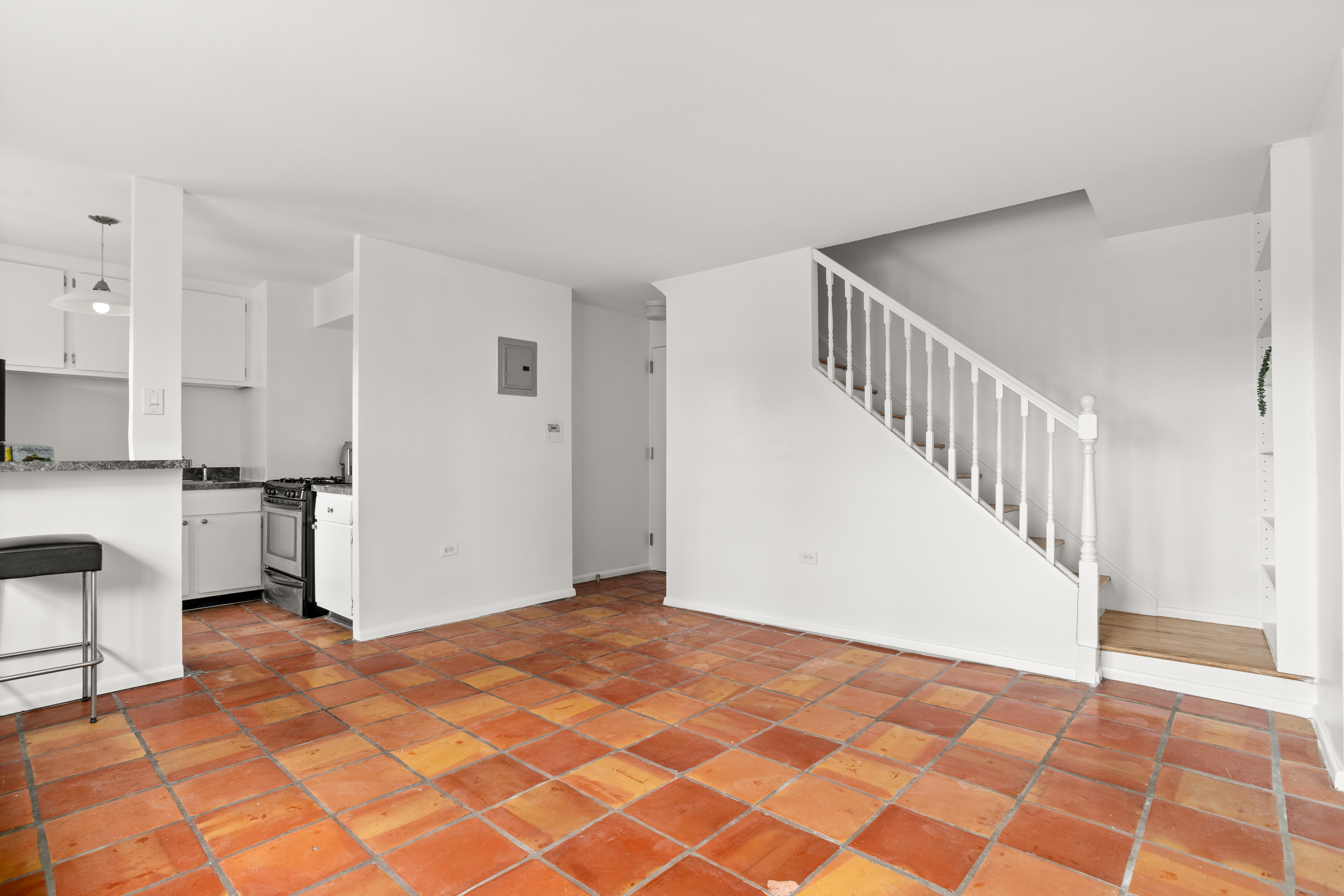 609 Columbus Avenue, Unit 14E Manhattan, NY 10024 - Photo 15 of 24 a view of an empty room with kitchen and a window