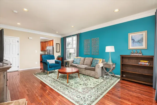 a living room with furniture and a rug