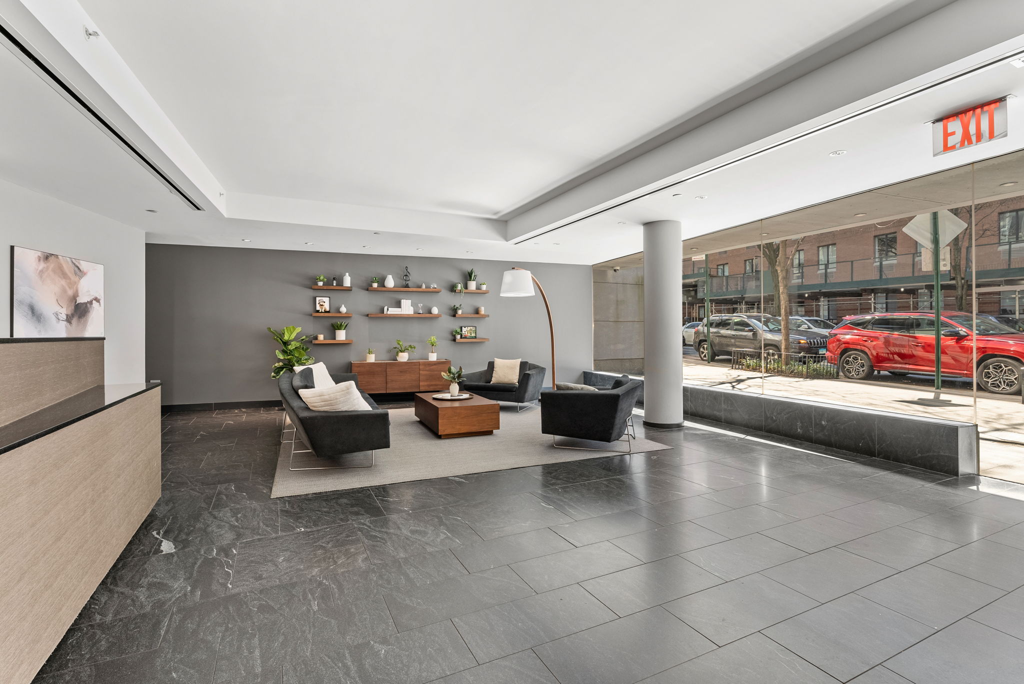 425 West 53rd Street, Unit 416 Manhattan, NY 10019 - Photo 14 of 19 a living room with furniture and a large window
