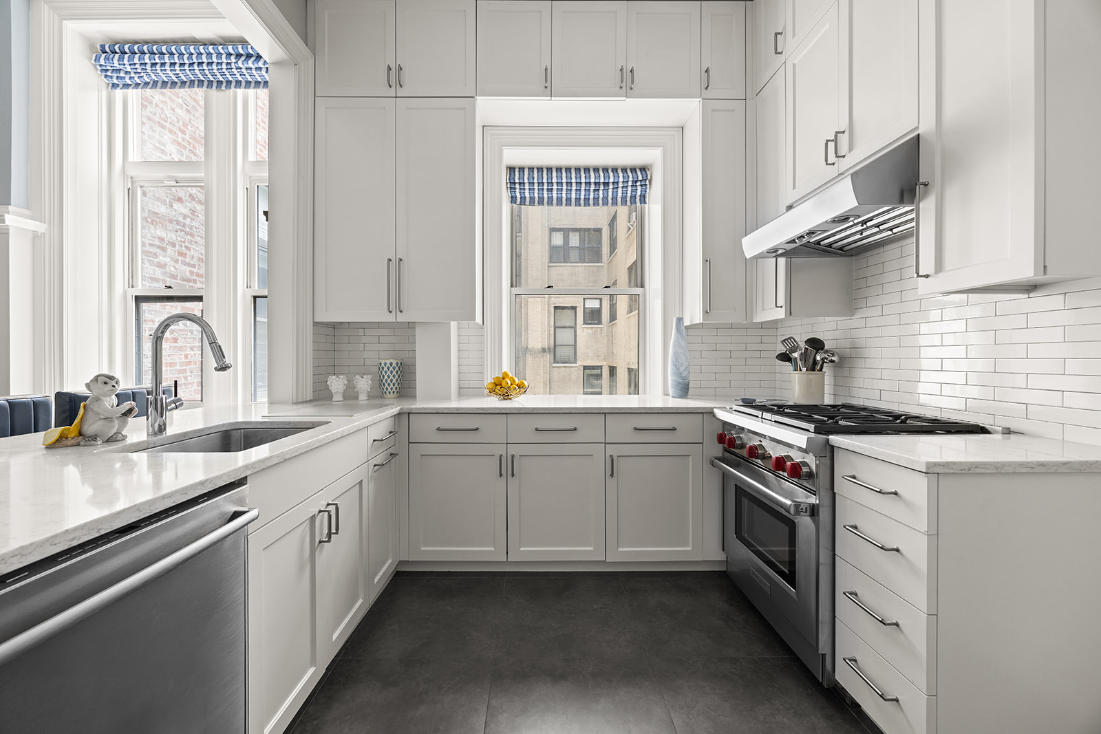 895 West End Avenue, Unit 1B Manhattan, NY 10025 - Photo 6 of 23 a kitchen with stainless steel appliances granite countertop a sink stove and cabinets