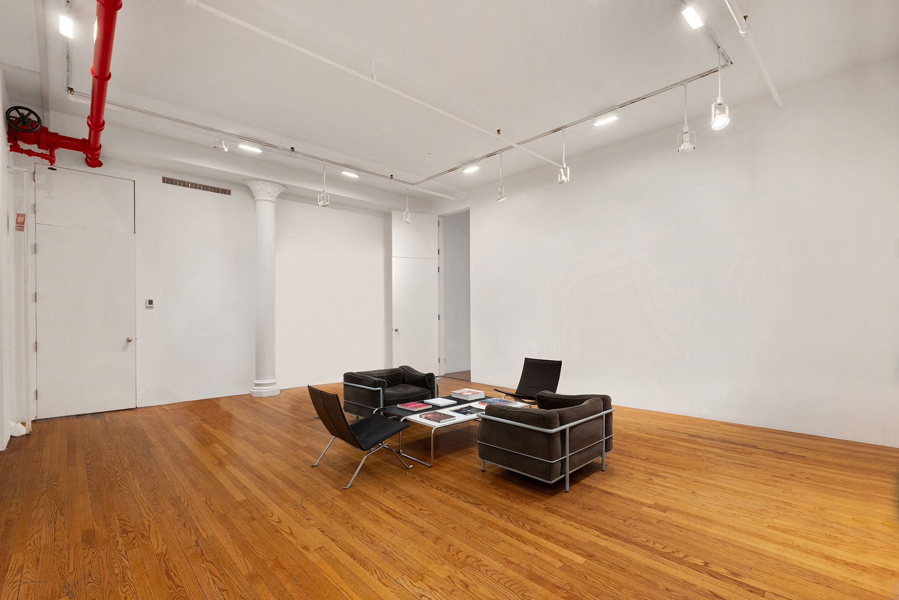 59 Wooster Street Manhattan, NY 10012 - Photo 5 of 10 a room with table and wooden floor