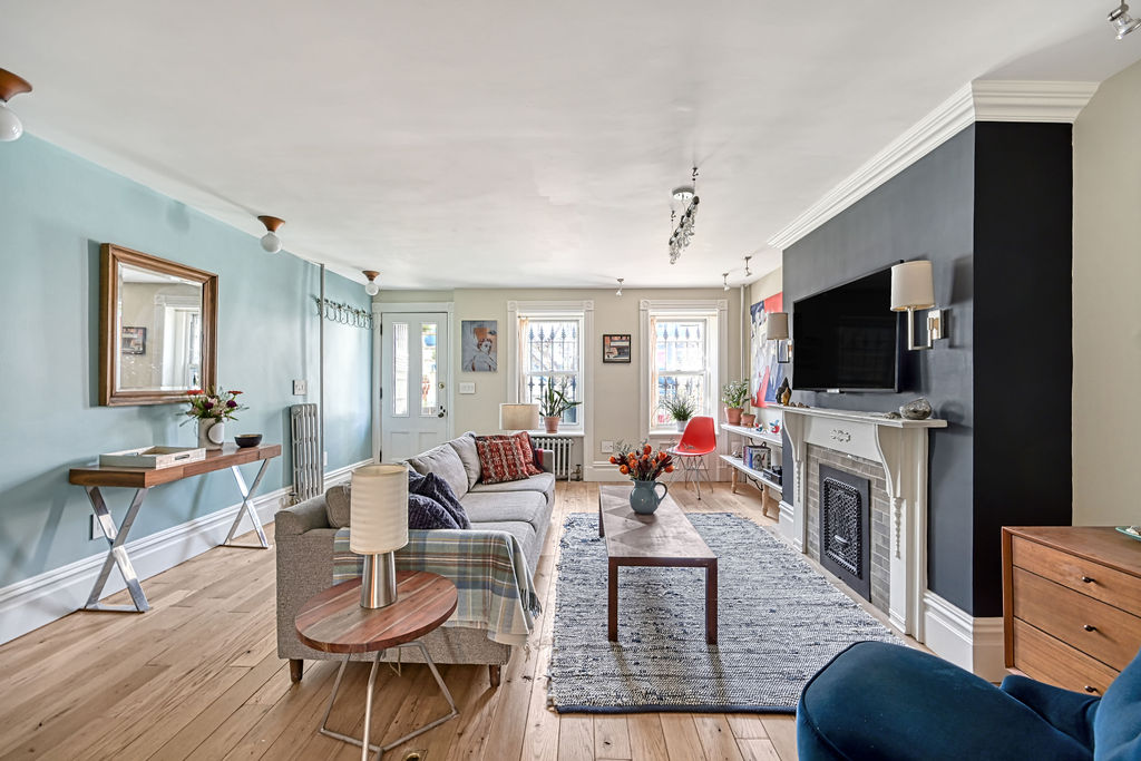 a living room with furniture and a flat screen tv
