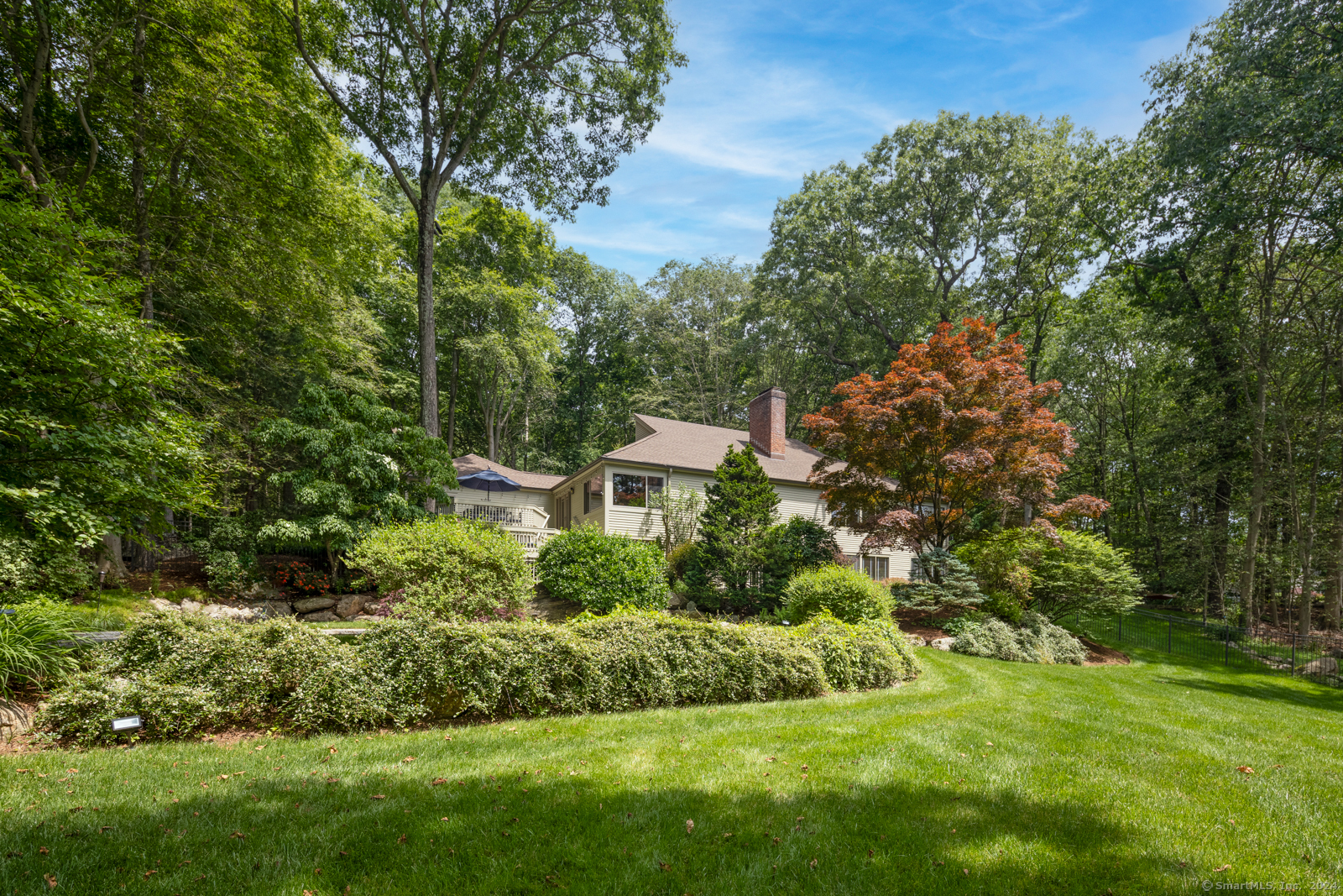 13 Bittersweet Road Weston, CT 06883 - Photo 28 of 35 a view of a garden with large trees
