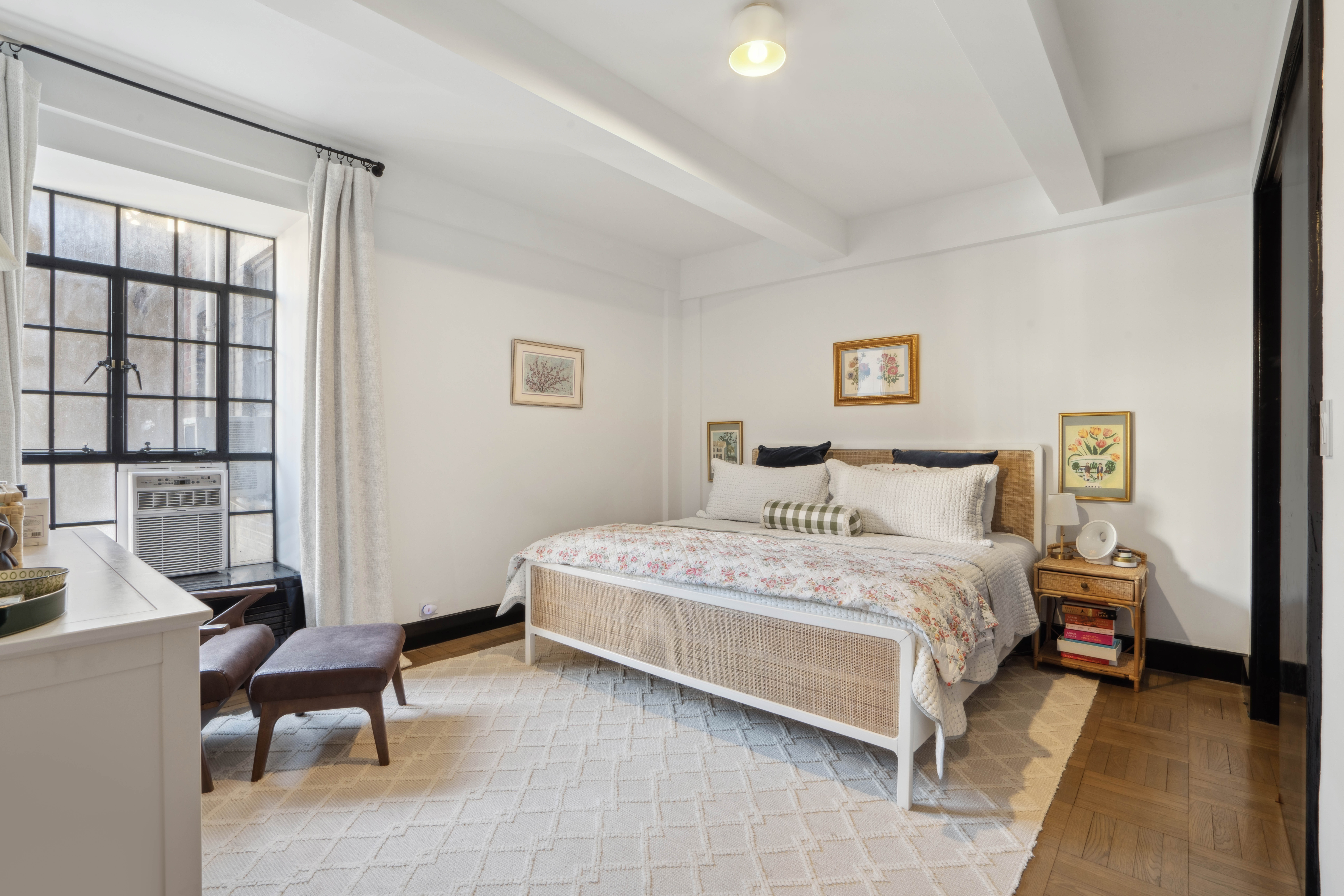 25 Monroe Place, Unit 6F Brooklyn, NY 11201 - Photo 2 of 7 a bedroom with a bed a chair and next to a window