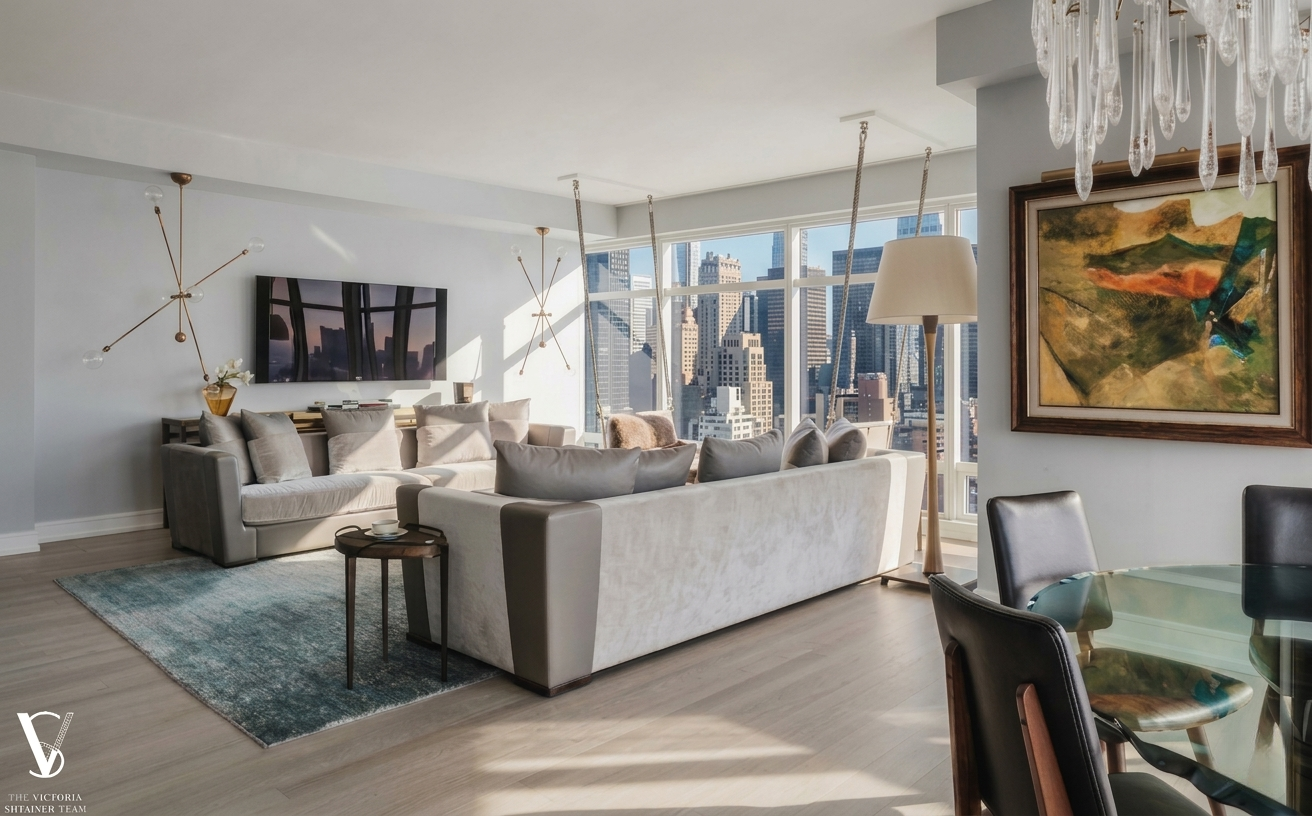 151 East 58th Street, Unit 38A Manhattan, NY 10022 - Photo 2 of 13 a living room with furniture and a flat screen tv