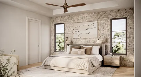 a bedroom with a large bed and a window