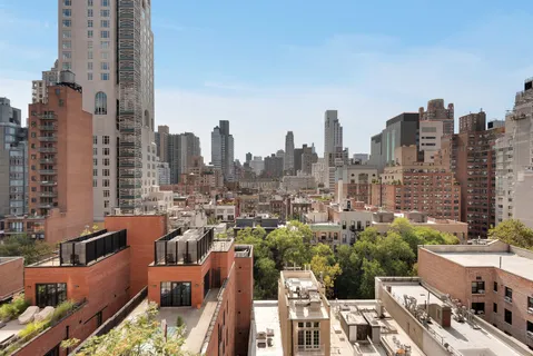 a view of a city with tall buildings