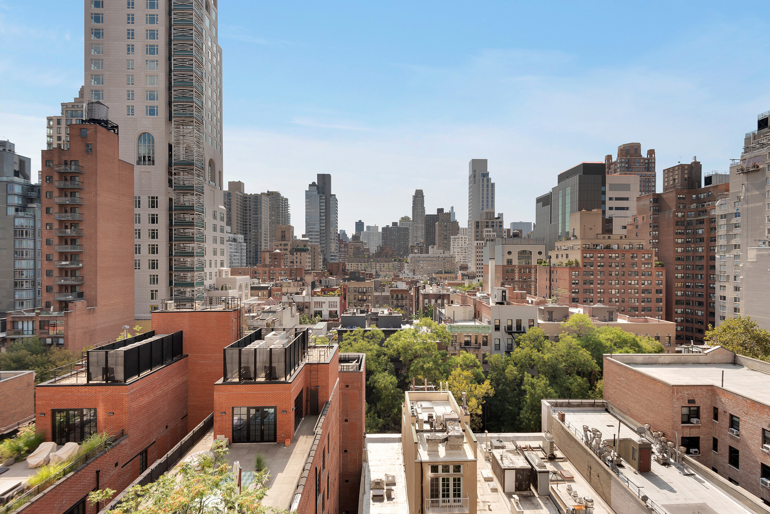 230 East 79th Street, Unit 12F Manhattan, NY 10075 - Photo 6 of 7 a view of a city with tall buildings