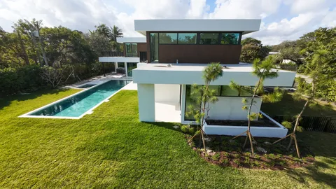 a swimming pool with outdoor seating and yard