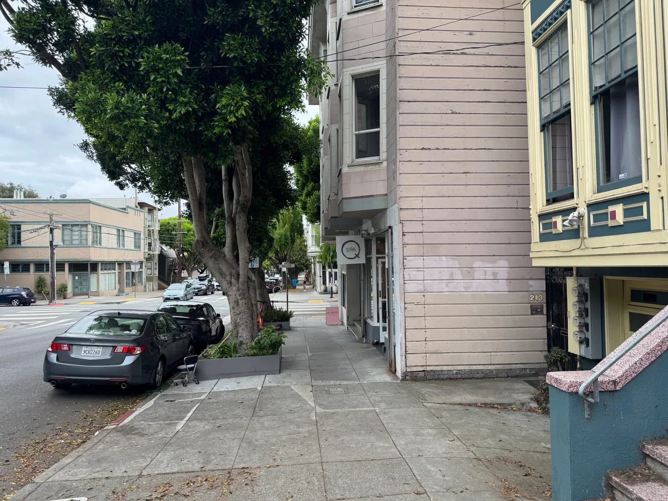 a couple of cars parked in front of a house