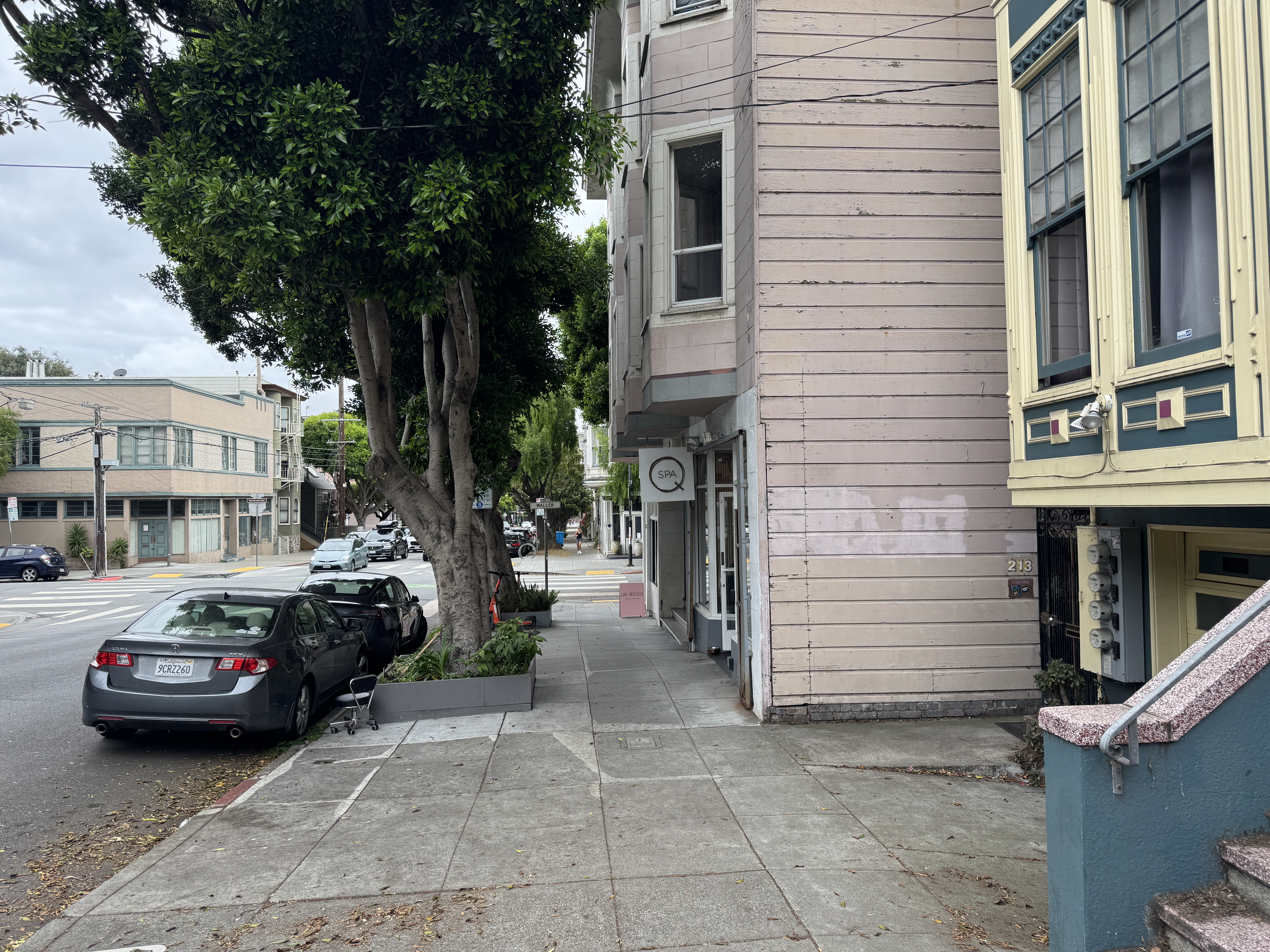 211 Steiner Street San Francisco, CA 94117 - Photo 1 of 15 a couple of cars parked in front of a house